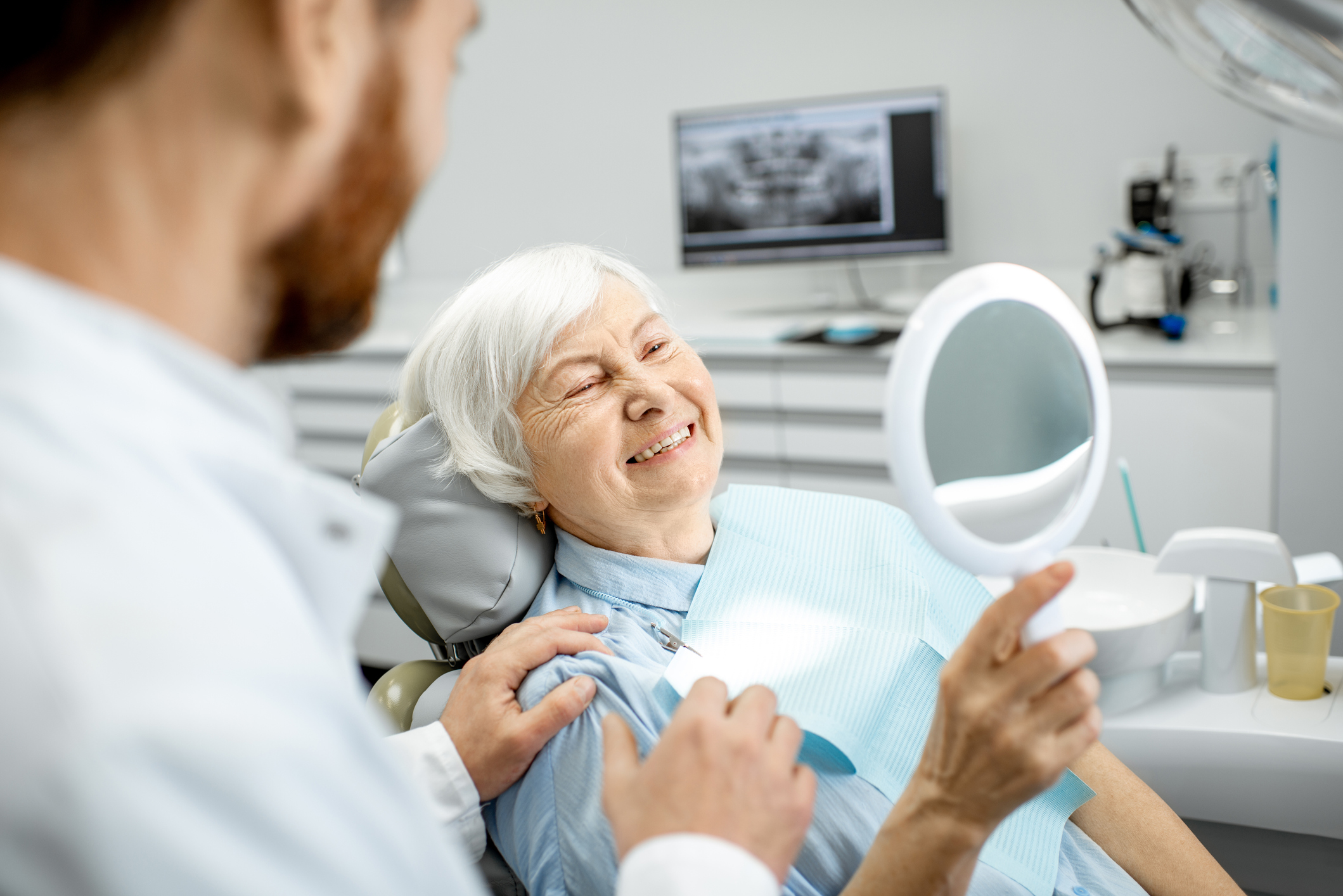 Old woman at the dentist's clinic